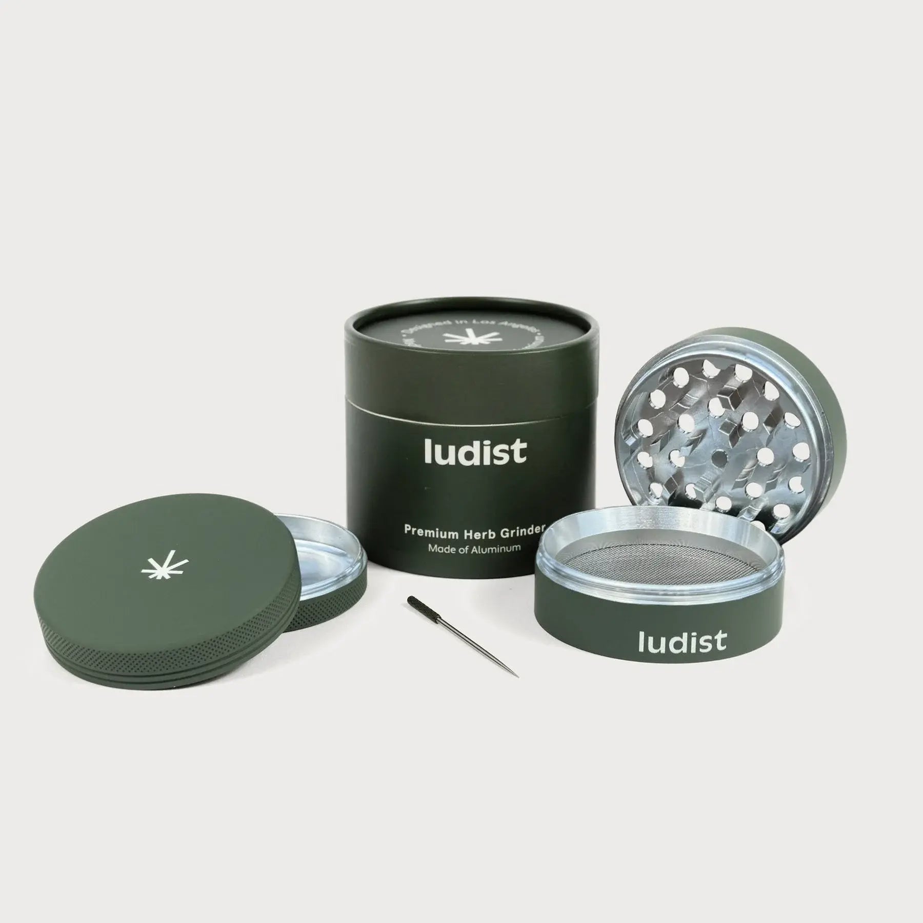 A single green leaf against a white background.