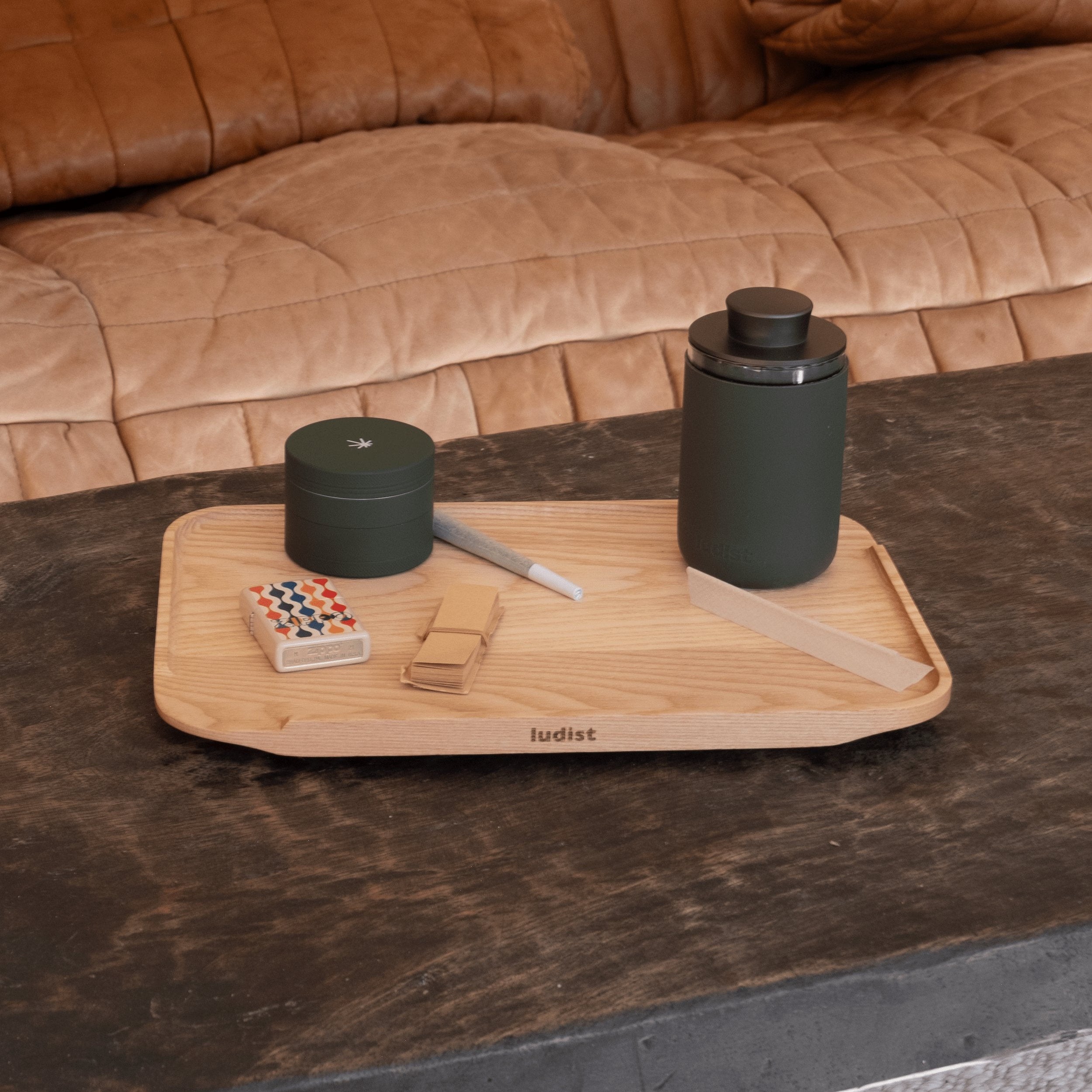 A single green leaf against a white background.