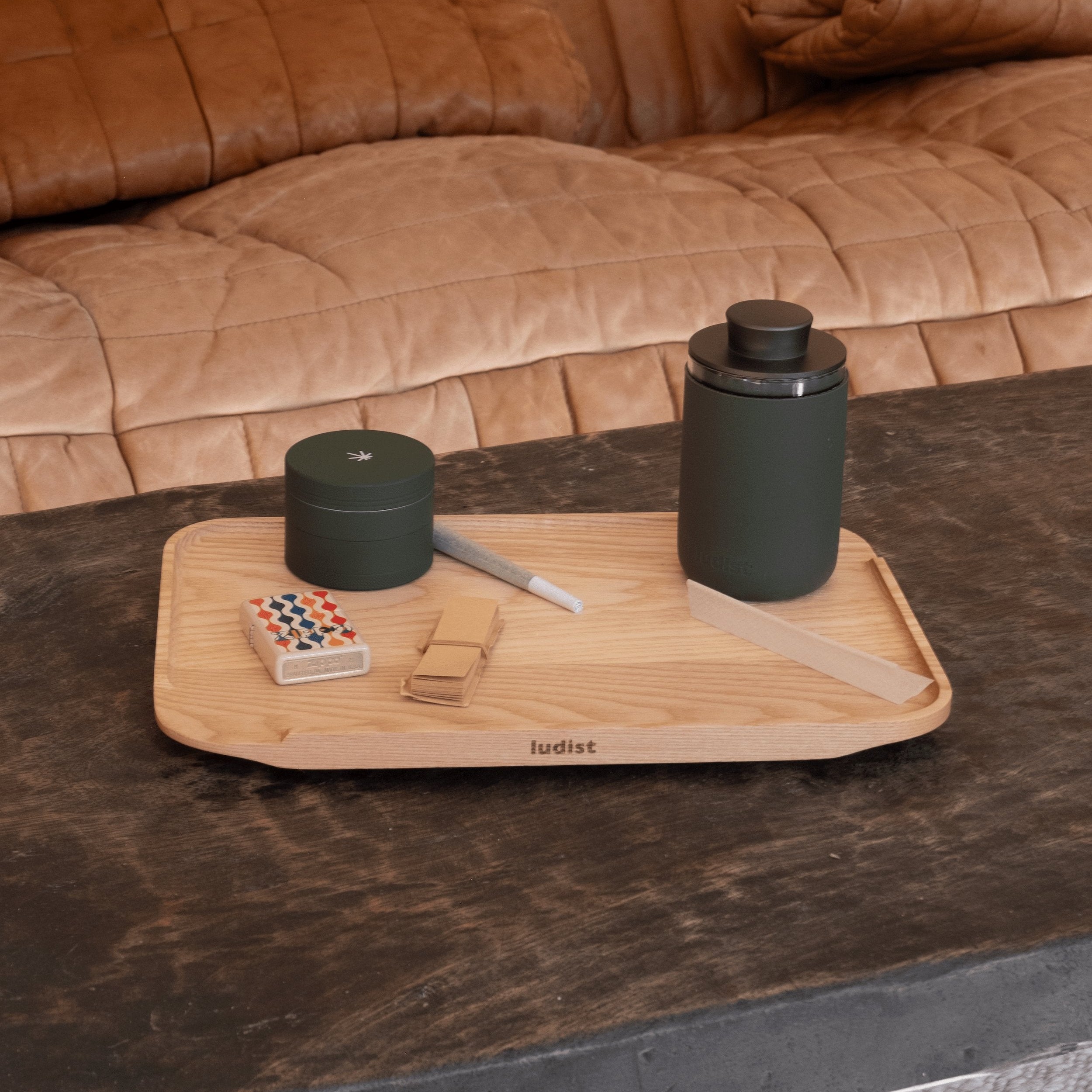 A single green leaf against a white background.