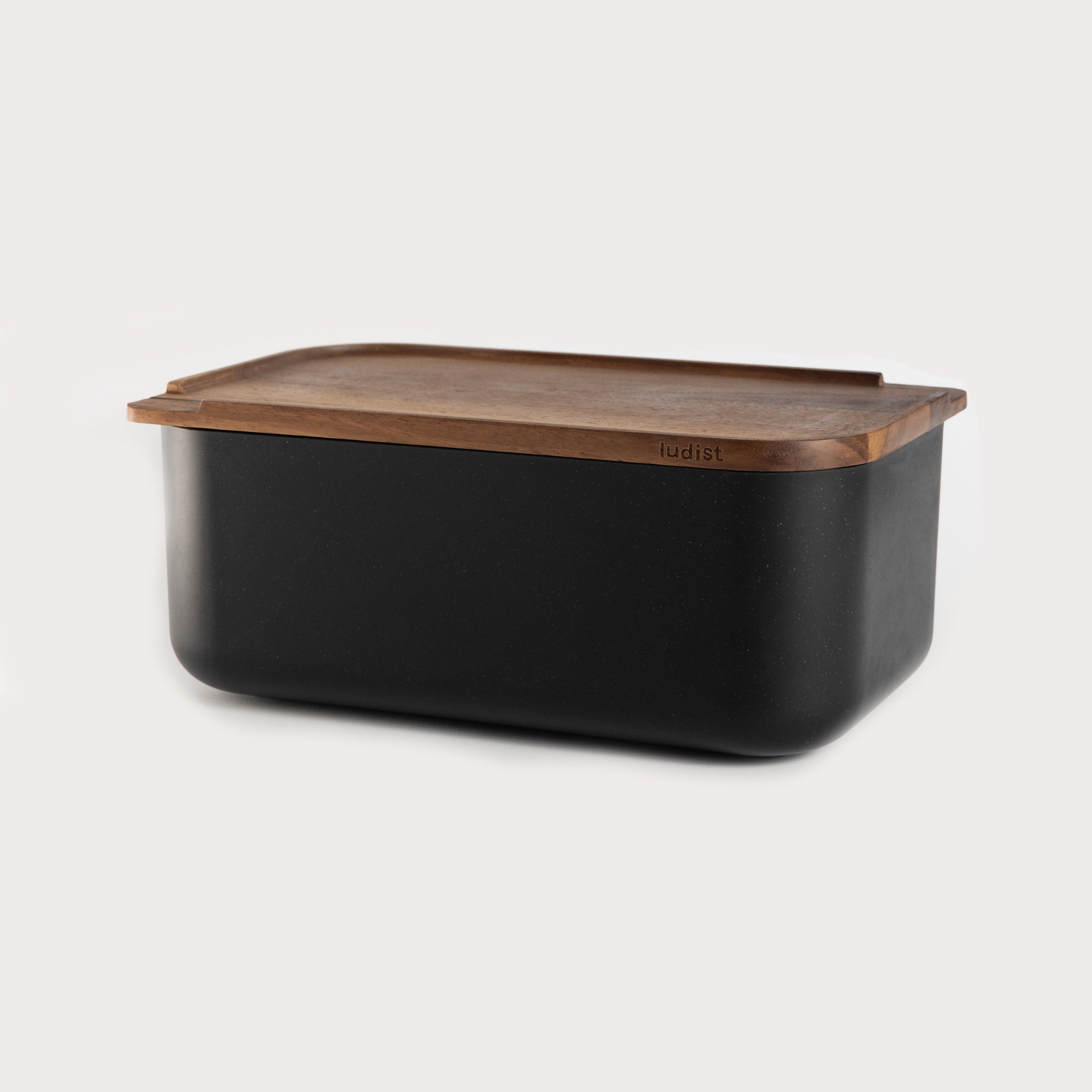 A single green leaf against a white background.