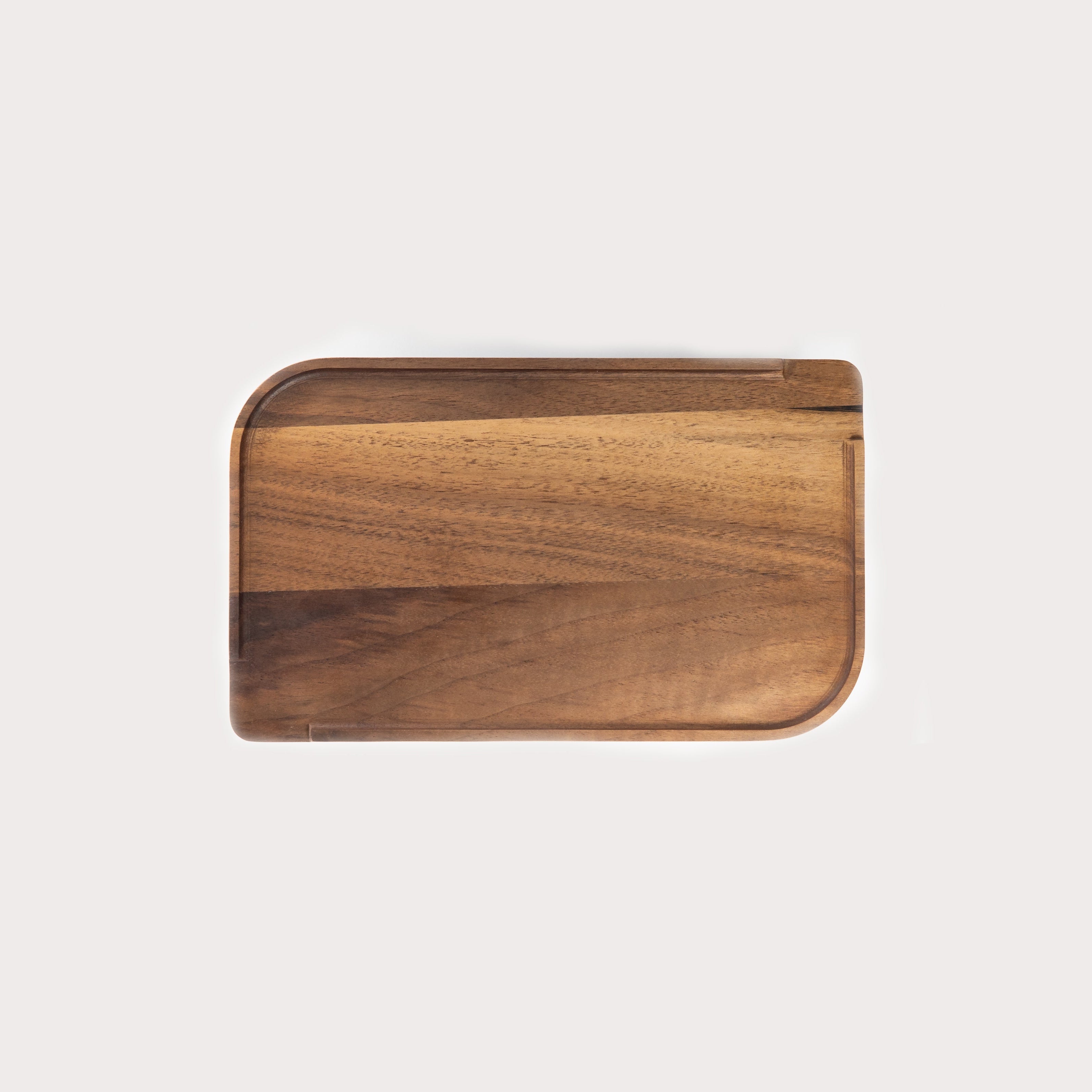 A single green leaf against a white background.