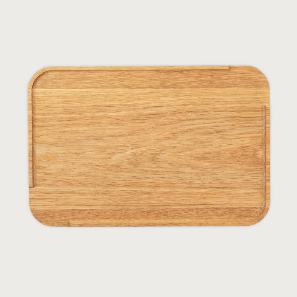 A single green leaf against a white background.